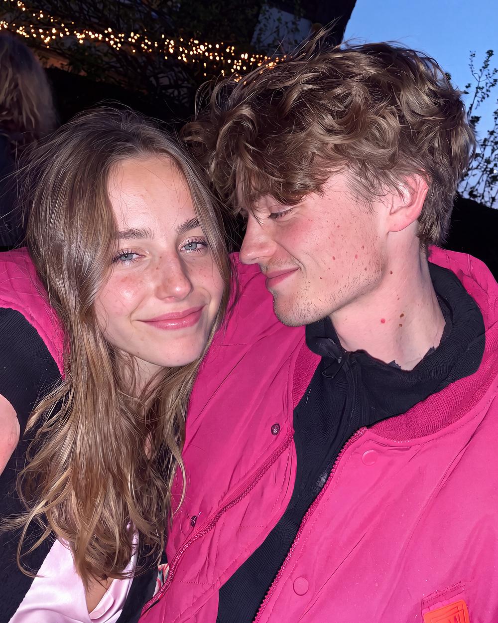 Couple in pink jackets at night
