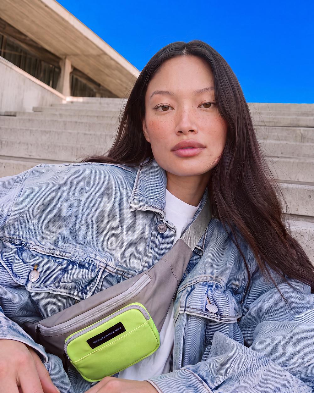 Denim jacket, neon bag