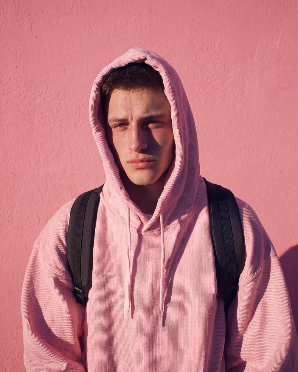Pink hoodie, pink wall