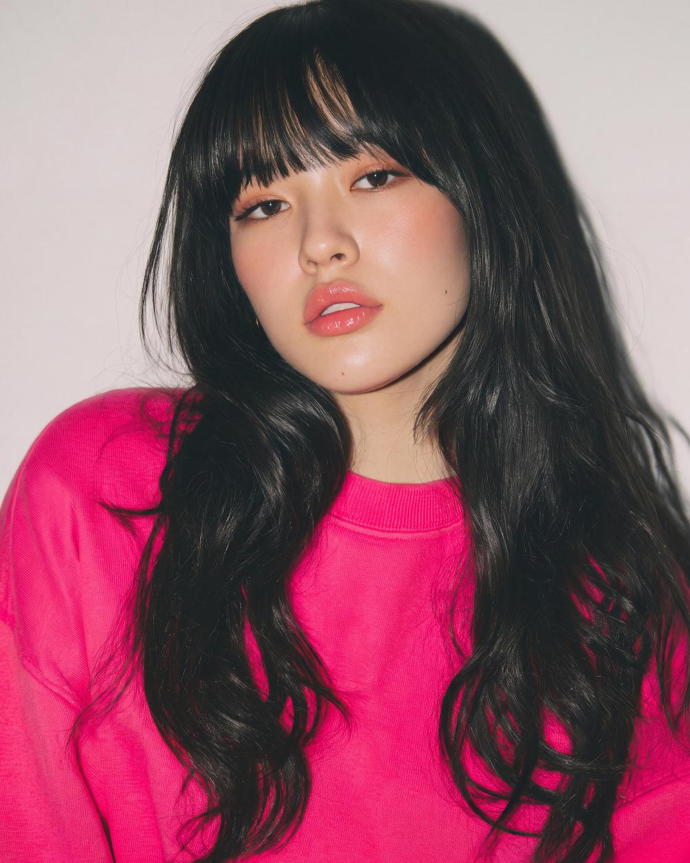 Pink sweatshirt, long hair