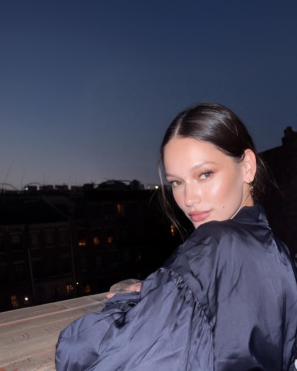 Woman on a rooftop at dusk